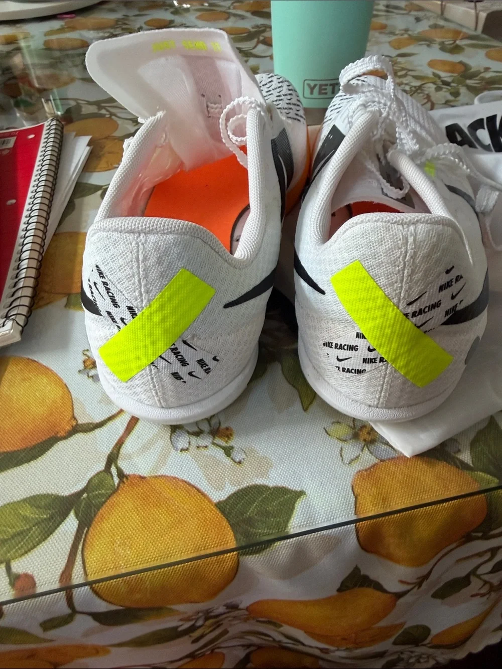 Nike men’s 10.5 track White Running Shoes with Orange and Neon Green Accents